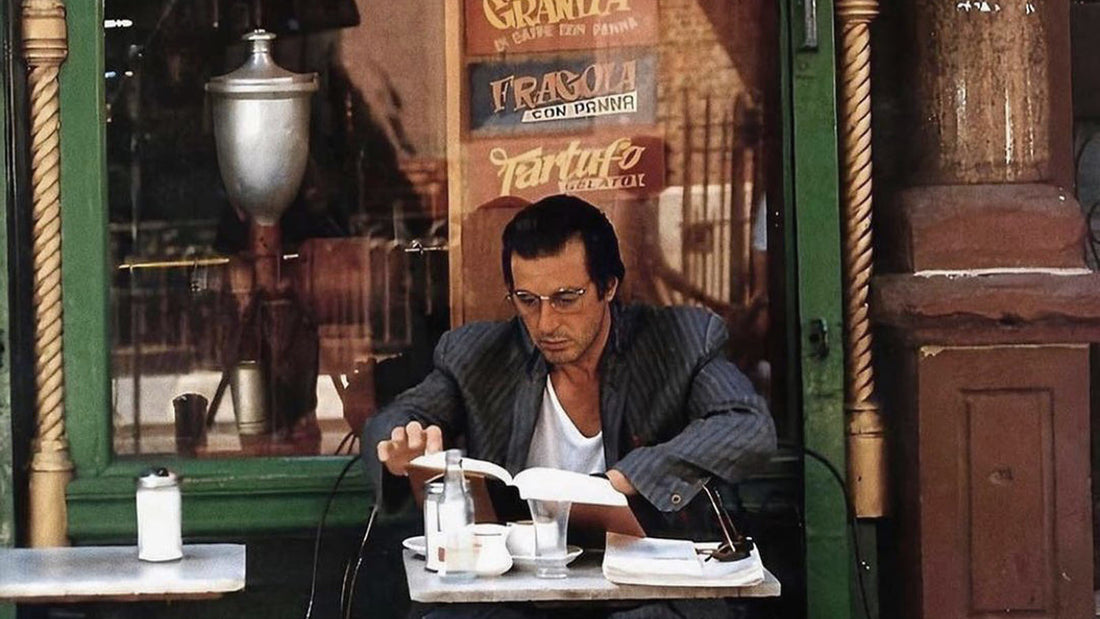 Al Pacino reading outside a cafe in New York City