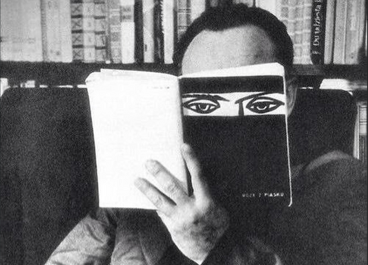 Jean Cocteau Reading a Book at Home