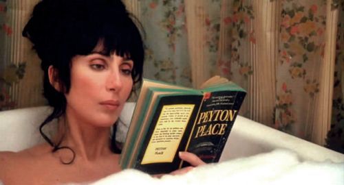 Cher reading a book in the bath from the film Mermaids