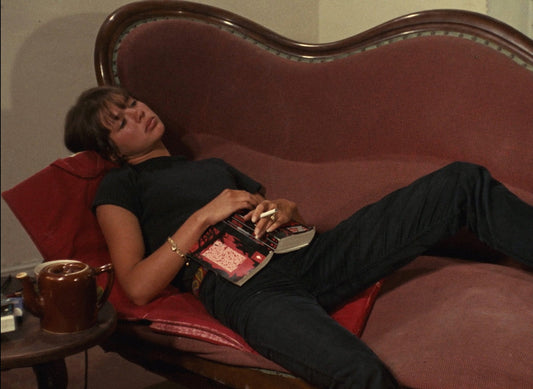 Eric Rohmer reading a book