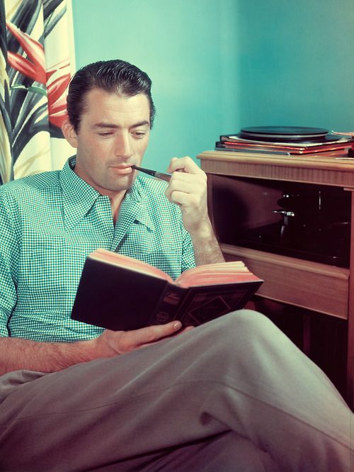 Gregory Peck Reading a Book and Smoking a Pipe whilst listening to music