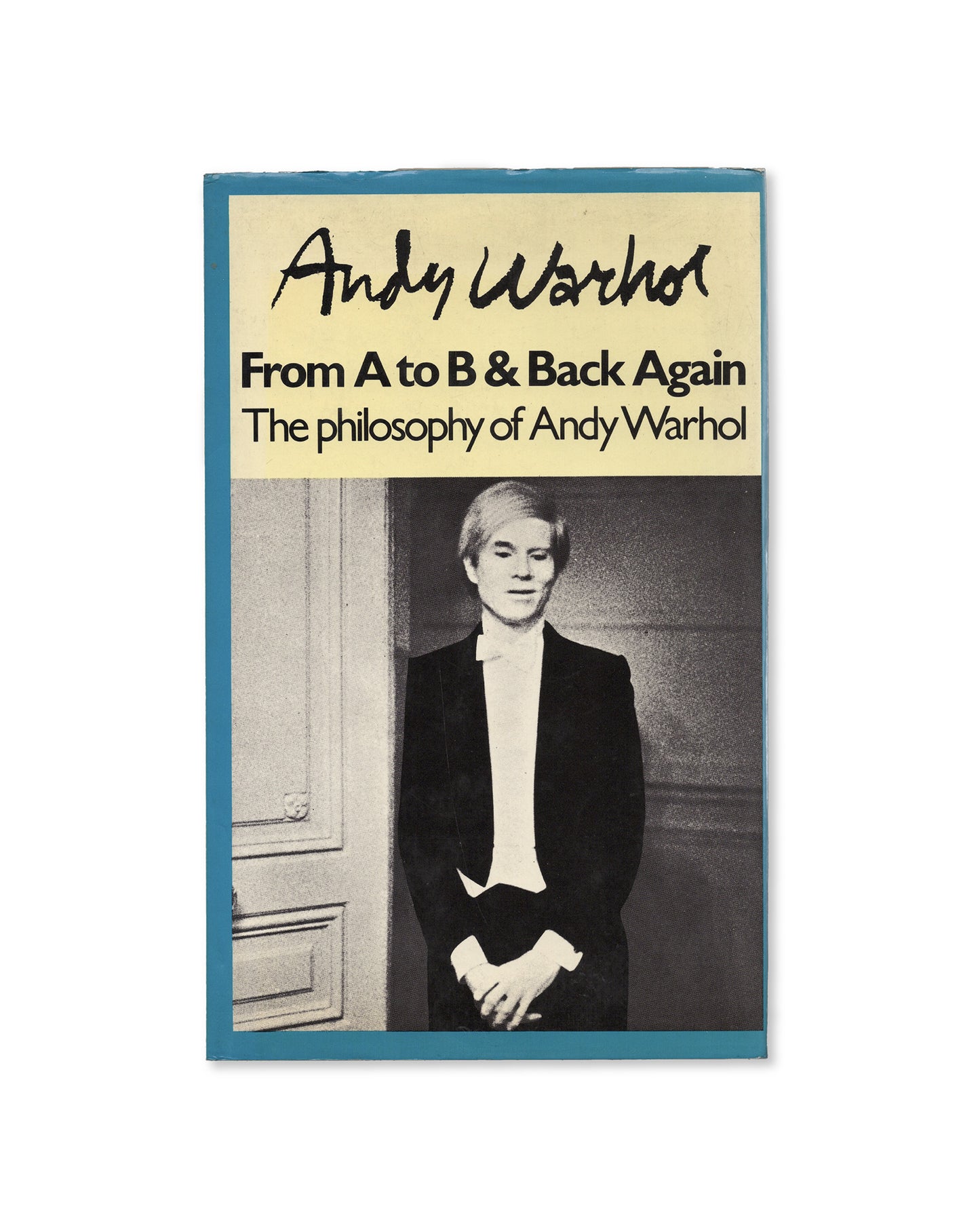 Cover of Andy Warhol's book 'From A to B & Back Again' featuring a photograph of Warhol against a blue background.