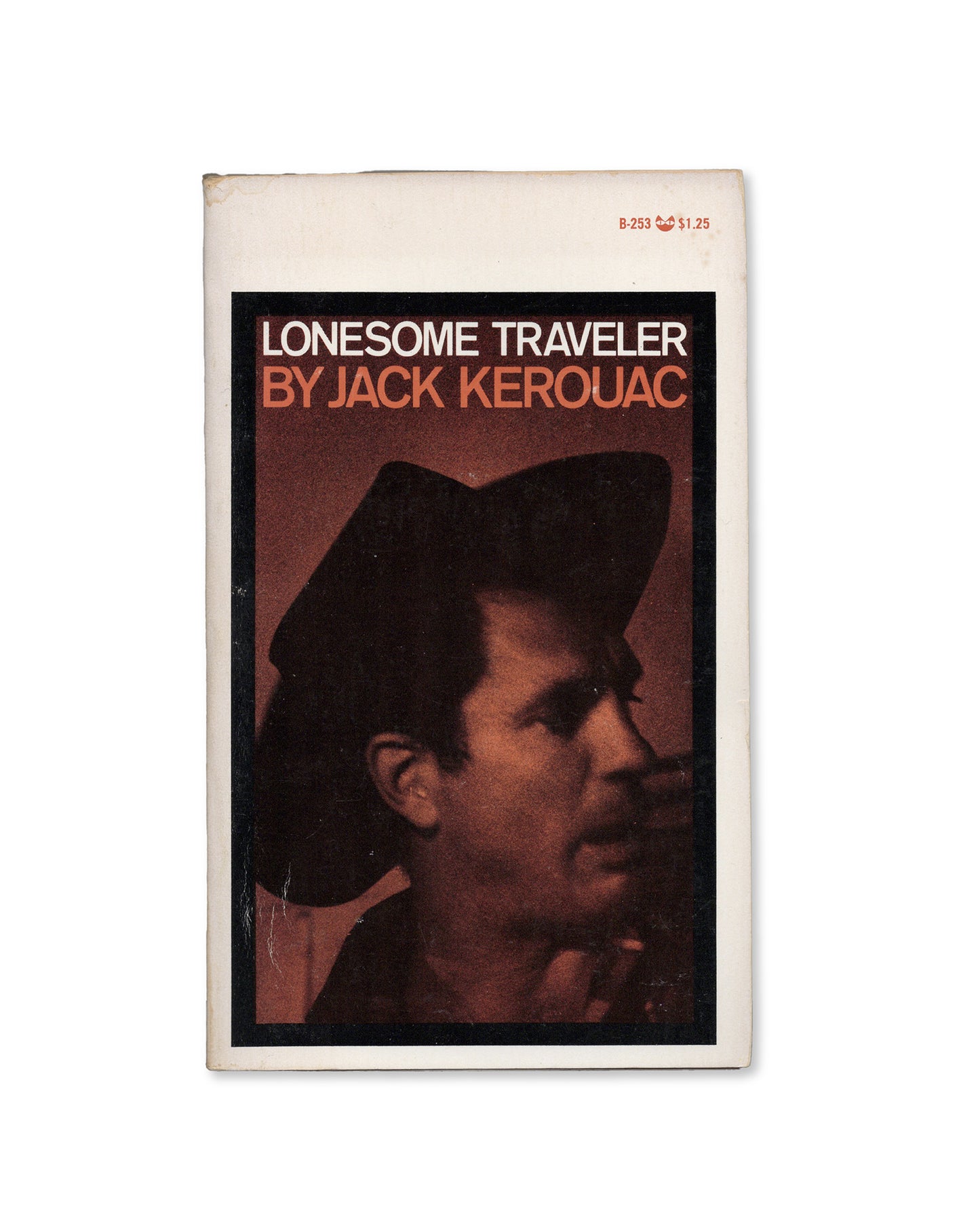 A paperback edition of 'Lonesome Traveler' by Jack Kerouac, featuring a photograph of Kerouac on the cover.