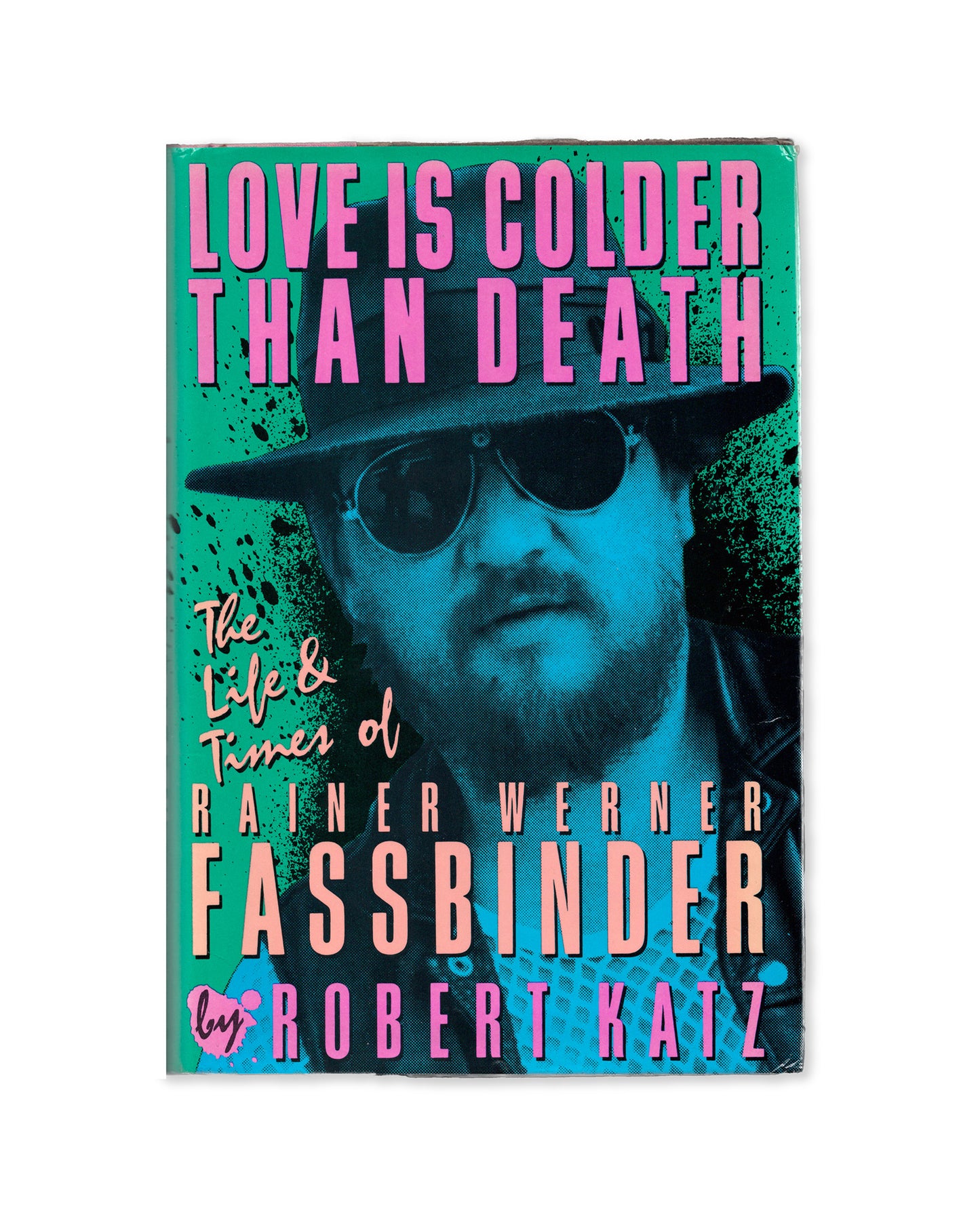 Book cover of 'Love is Colder than Death: The Life and Times of Rainer Wernder Fassbinder' featuring a photograph of the director with a green and pink color scheme.