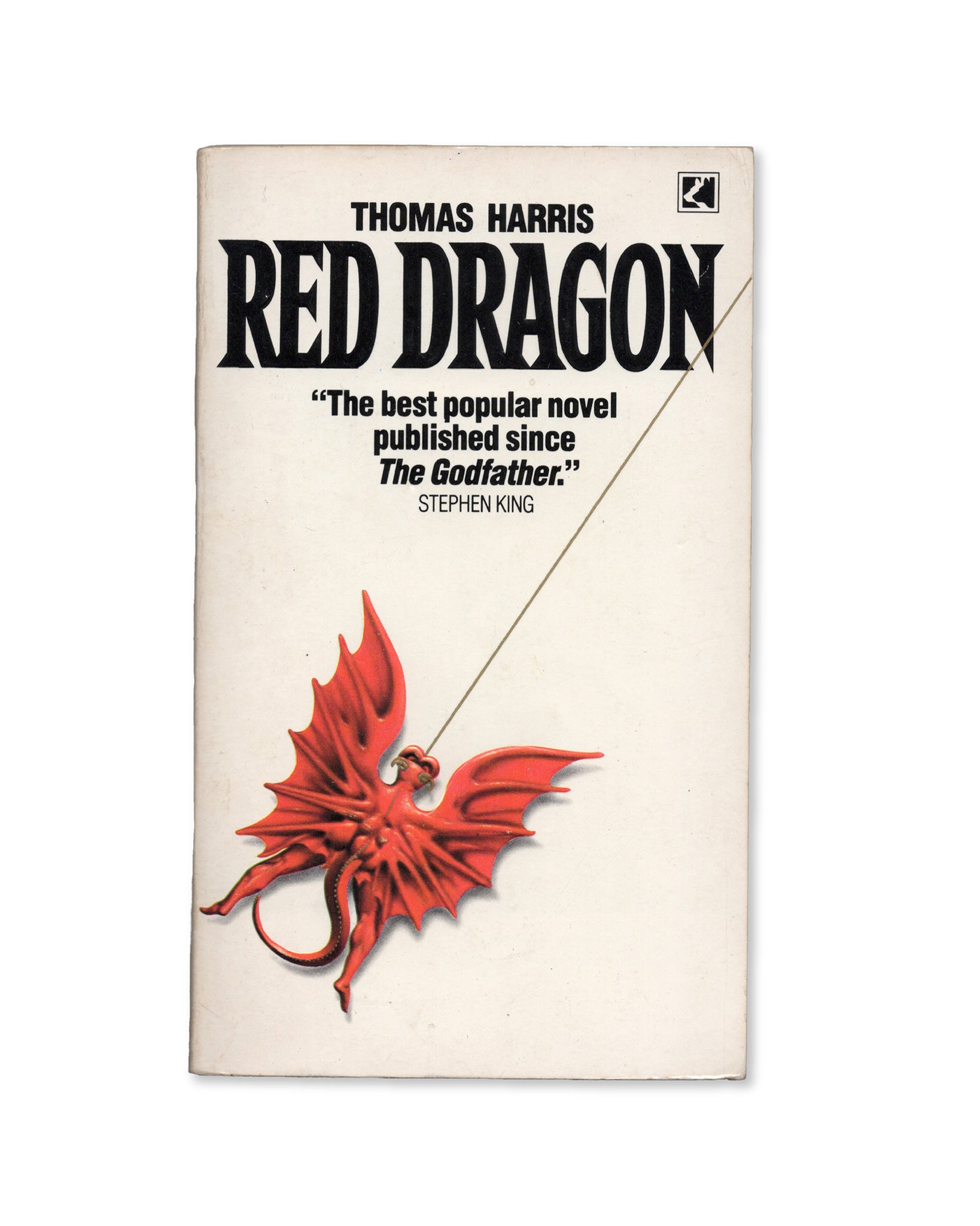 A UK edition of the book 'Red Dragon' by Thomas Harris with a red dragon illustration on the cover and the title prominently displayed.