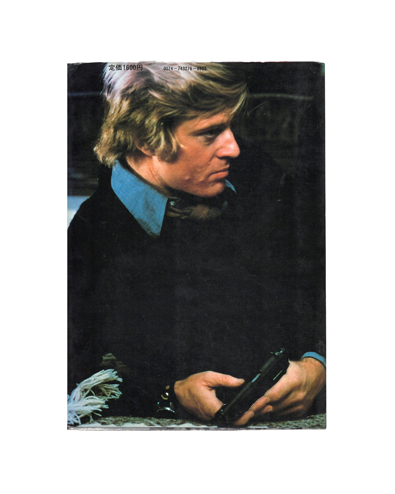 A cover image of a book featuring a photograph of a man, identified as Robert Redford, with a cinematic theme.