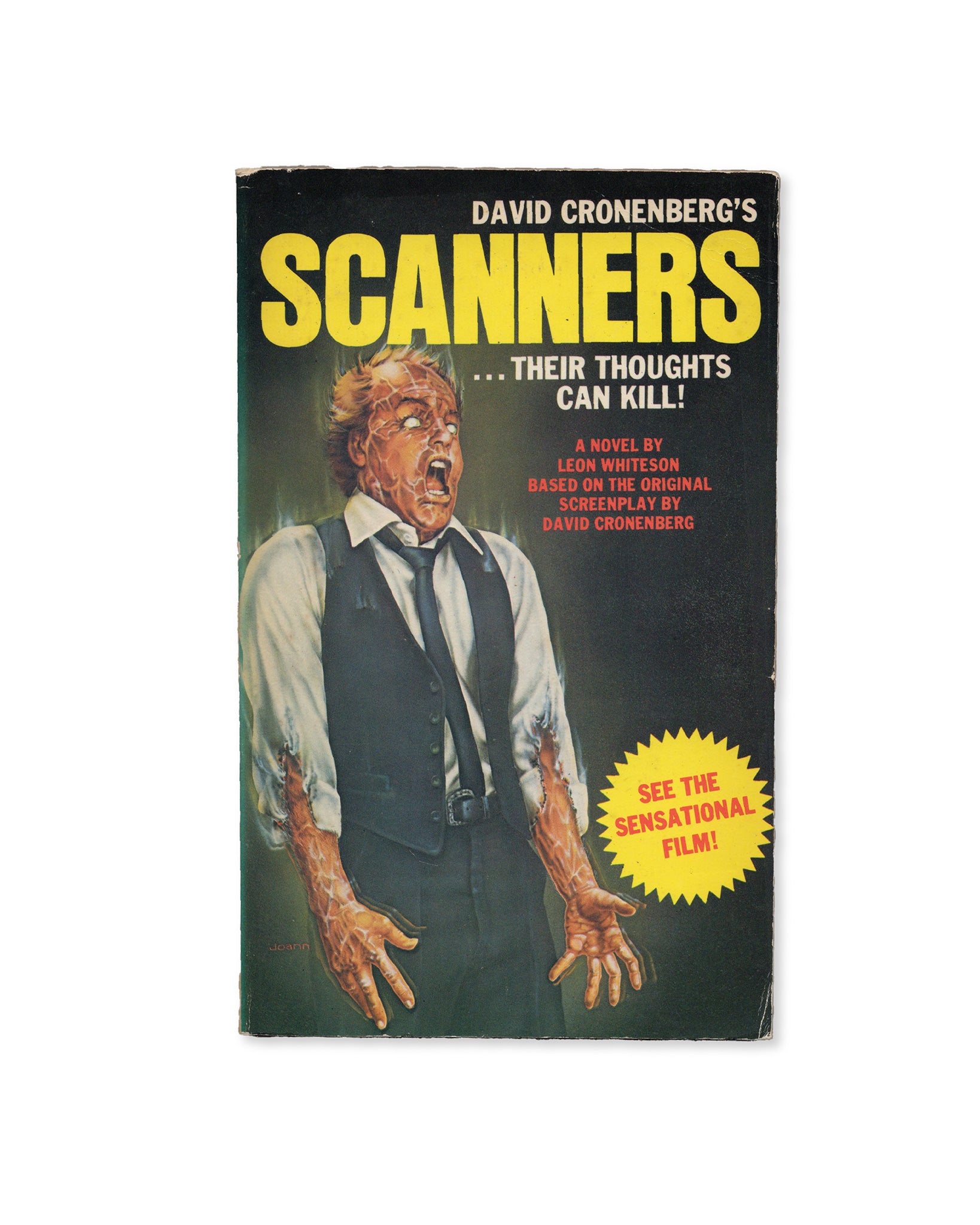 A cover of the novelisation 'Scanners' by David Cronenberg, featuring an illustration of a man with a contorted expression, with the tagline 'Their thoughts can kill' and an advertisement for the movie.