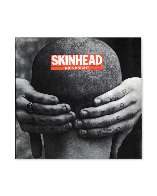 Book cover for 'Skinhead' by Nick Knight featuring a person holding their head with hand tattoos.