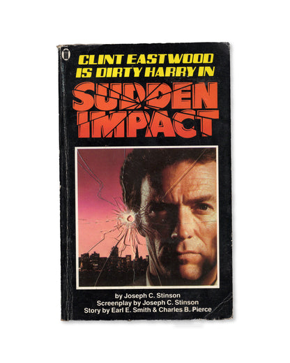 Book cover of 'Sudden Impact' featuring Clint Eastwood as Dirty Harry with a cityscape background.