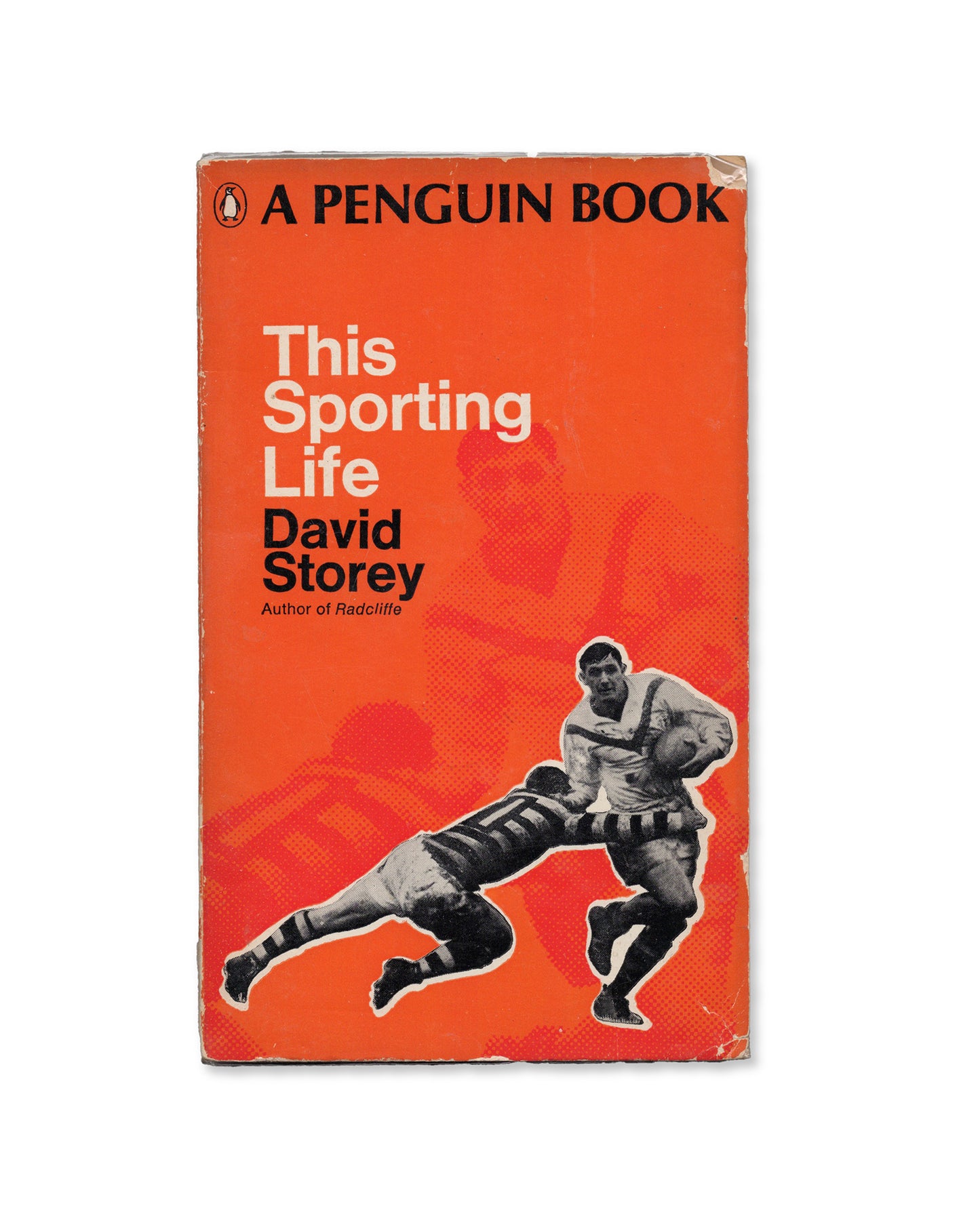Book Cover of 'This Sporting Life' by David Storey, featuring a black and white photo of a rugby player on a red background.