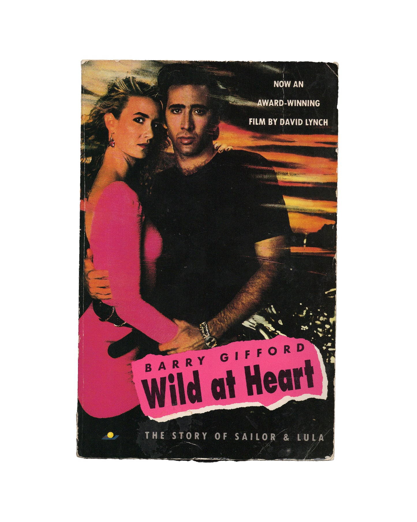 The cover of the book 'Wild at Heart' by Barry Gifford features images of the main characters, played by Nicolas Cage and Laura Dern in the David Lynch adaptation.